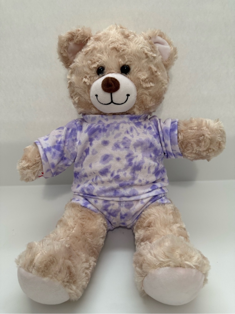 Build-A-Bear tie-dye loungewear outfit on a stuffed teddy bear